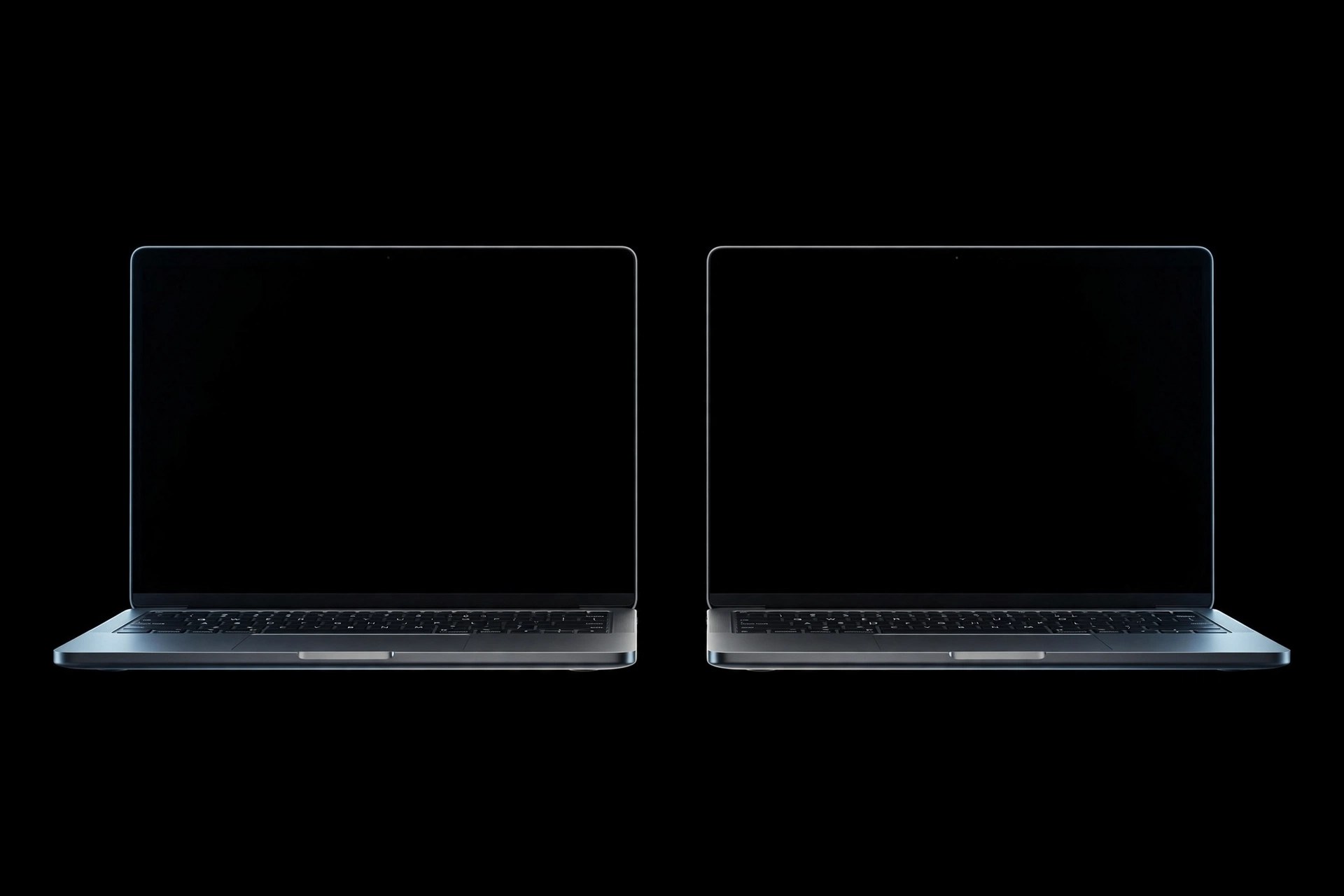 Two laptops floating in a black void